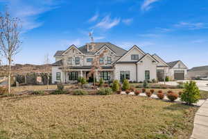 View of front of property with a front lawn