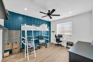 Bedroom featuring light hardwood / wood-style floors and ceiling fan