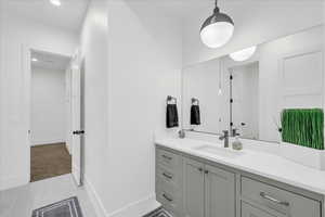 Bathroom featuring vanity and tile patterned floors