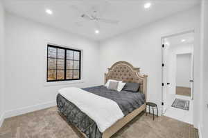 Bedroom with ceiling fan and light tile patterned floors