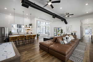 Living room featuring french doors, dark hardwood / wood-style floors, and a healthy amount of sunlight