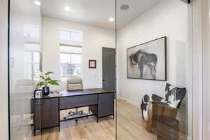 Office featuring hardwood / wood-style floors