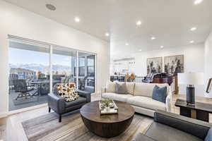 Living room with a mountain view and light wood-type flooring