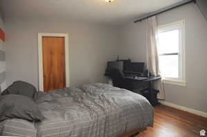 Bedroom featuring dark hardwood / wood-style floors