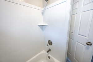 Bathroom featuring bathing tub / shower combination