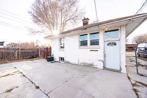 Back of property with a patio