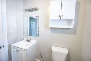 Bathroom with vanity and toilet