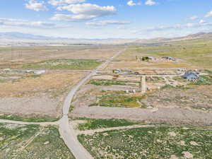 Birds eye view of property featuring a mountain view and a rural view