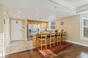 Gourmet kitchen with Granite Countertops, NEW refrigerator, NEW oven, plenty of counter space, and pantry storage