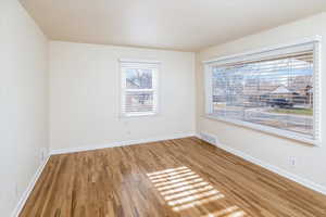 Living room with hardwood / wood-style flooring