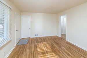 Spare room with light hardwood / wood-style floors