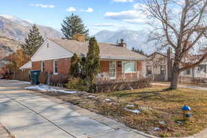 Single story home featuring a mountain view and covered porch