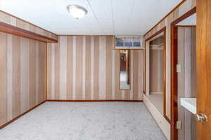 Bedroom featuring light colored carpet