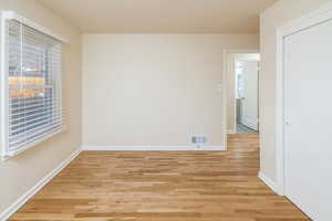 Bedroom with light hardwood / wood-style floors