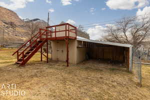 View of outdoor shed with loft and a carport featuring a mountain view