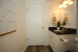 Bathroom featuring hardwood / wood-style floors and vanity