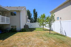 View of yard with central AC unit