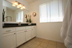 Bathroom with vanity and tile patterned floors