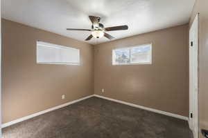 Bedroom #3 with ceiling fan and carpet floors