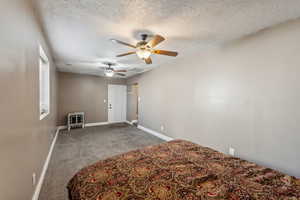 Bedroom #4 with ceiling fans and carpet floors