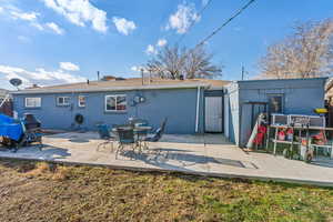 Rear view of property with large patio