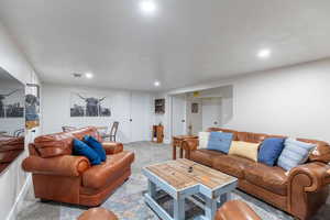 cozy family room complete with a charming fireplace, creating a warm and inviting atmosphere