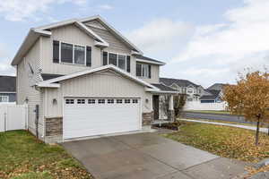 View of front of property featuring a garage