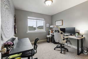 View of carpeted home office