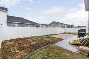 View of back yard featuring a patio area