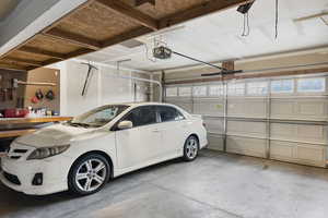 Garage featuring a garage door opener.