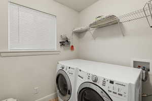 Washroom featuring separate washer and dryer