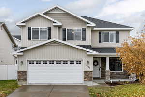 Craftsman-style home featuring a garage