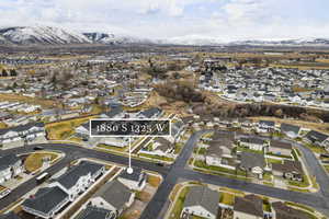 Birds eye view of property with a mountain view