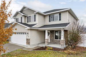 Craftsman-style house featuring a porch and a garage