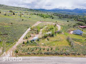 Overview of rural landscape featuring a mountainous background