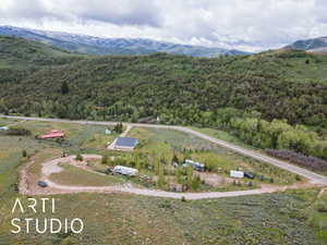 Aerial view of a heavily wooded area and mountains