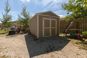 View of shed with fence