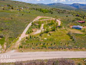 Birds eye view of property featuring a mountain view and a rural view