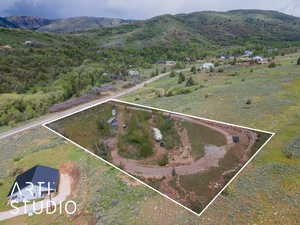 View of property location with mountains, property boundaries highlighted, and rural landscape