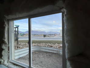 Basement window featuring a mountain view