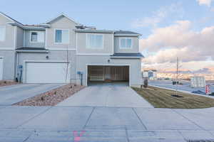 View of front of property featuring a garage