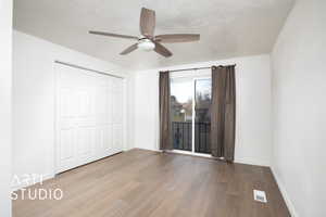 Unfurnished bedroom featuring ceiling fan, light hardwood / wood-style floors, and a closet