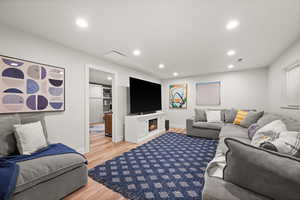 Living room with hardwood / wood-style flooring