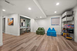 Sitting room featuring hardwood / wood-style flooring