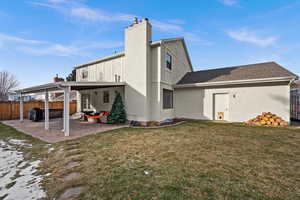 Rear view of property featuring an outdoor hangout area, a patio area, and a yard