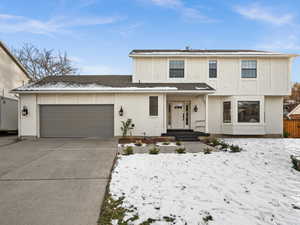 View of property with a garage