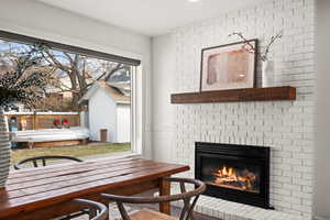 Interior space with a brick fireplace