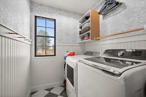 Washroom featuring washer and clothes dryer