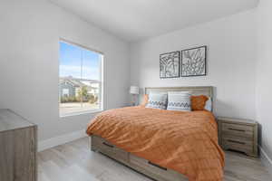 Bedroom with light hardwood / wood-style floors