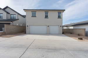 Rear view of house with a garage